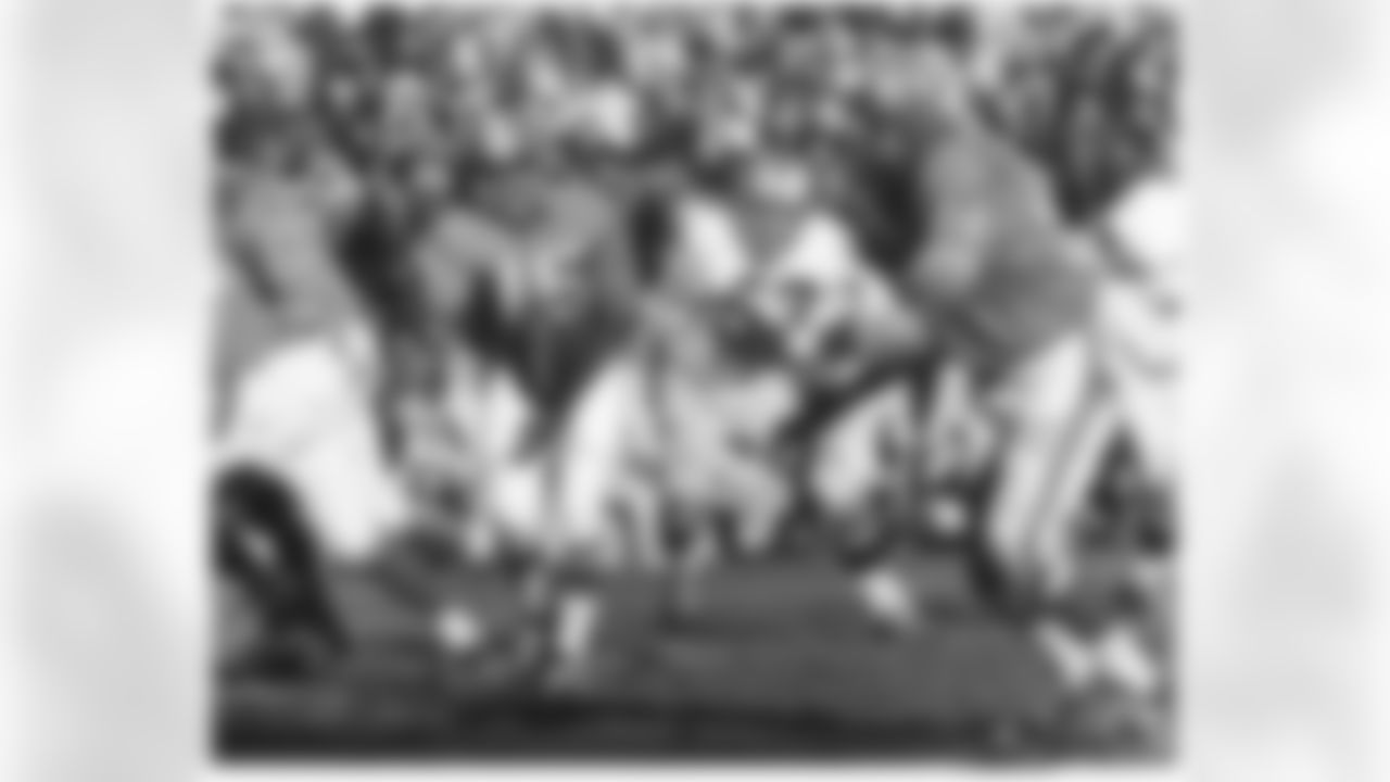 Denver Broncos quarterback tosses the ball to Floyd Little during a game against the Oakland Raiders in 1968.