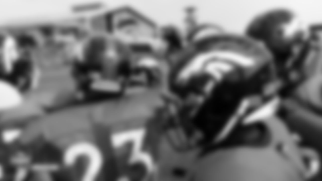 The running backs huddle up at the fifth day of training camp on August 1, 2018, at UCHealth Training Center.