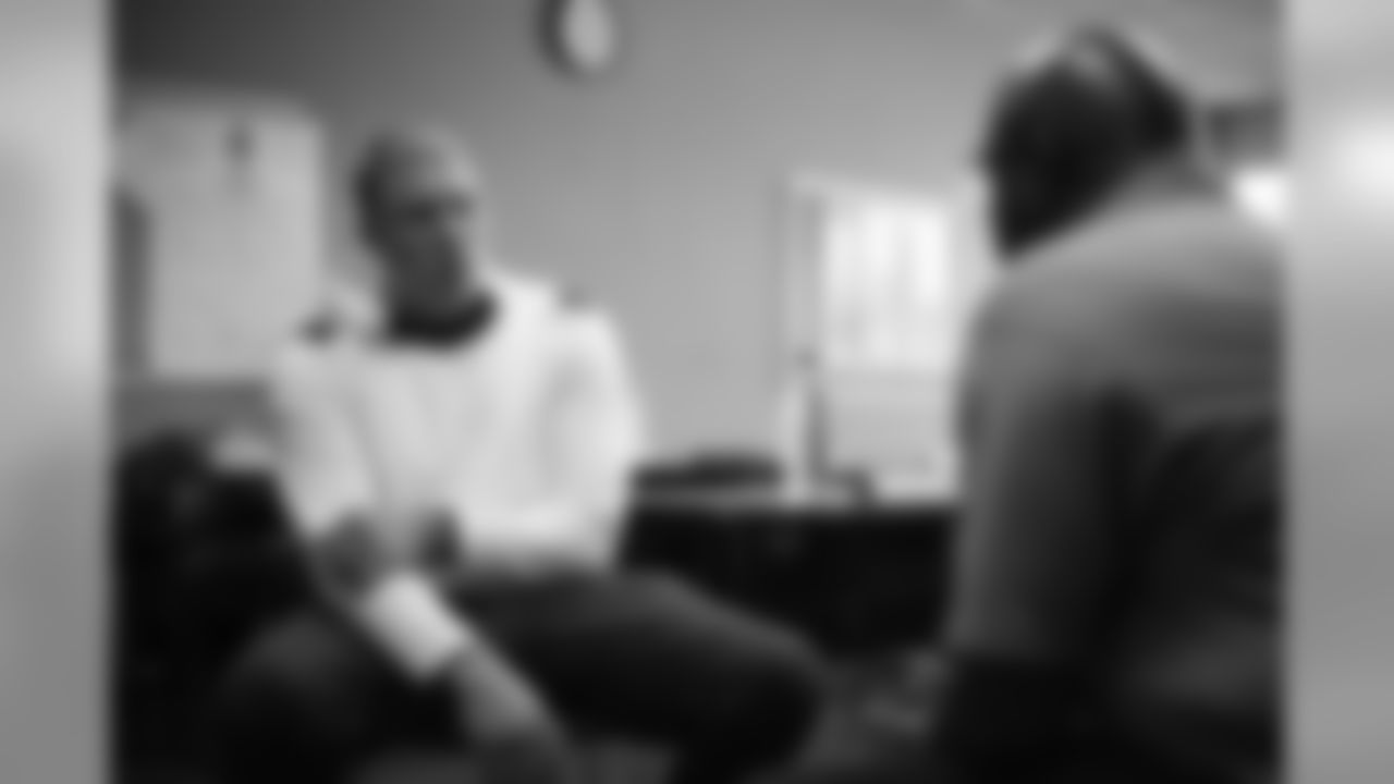 Garett Bolles talks with technician Tyrone Campbell during an immersive training experience at the Denver Police Academy on October 28, 2019. (Photo by Ben Swanson)