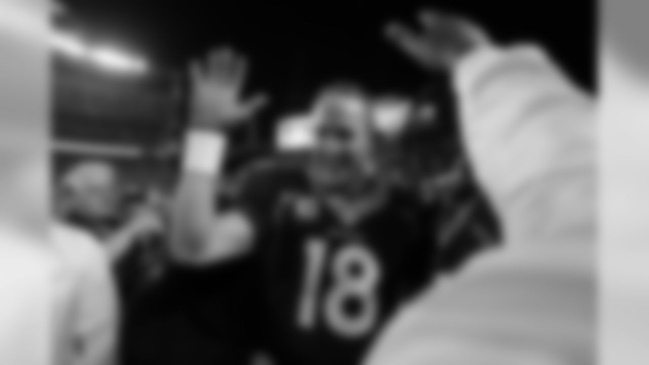 Peyton Manning celebrates after throwing his record-breaking 509th career touchdown with a strike to Demaryius Thomas against the 49ers.