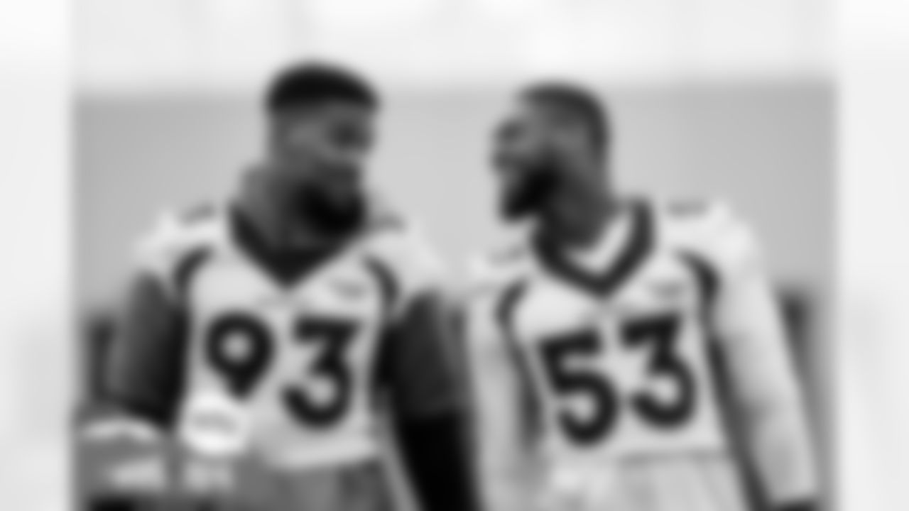 Dre'Mont Jones and Jonathon Cooper during practice at UCHealth Training Center in Englewood, Colorado on October 26, 2021. (Photo by Ben Swanson)