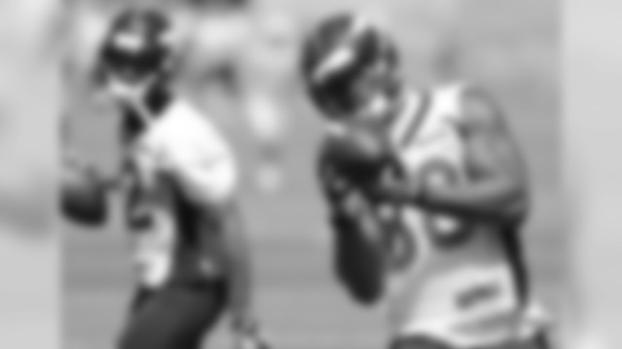 Thomas makes the catch as Caldwell looks back.