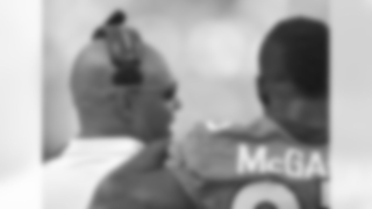 RB Willis McGahee watches with RB Coach Eric Studesville.
