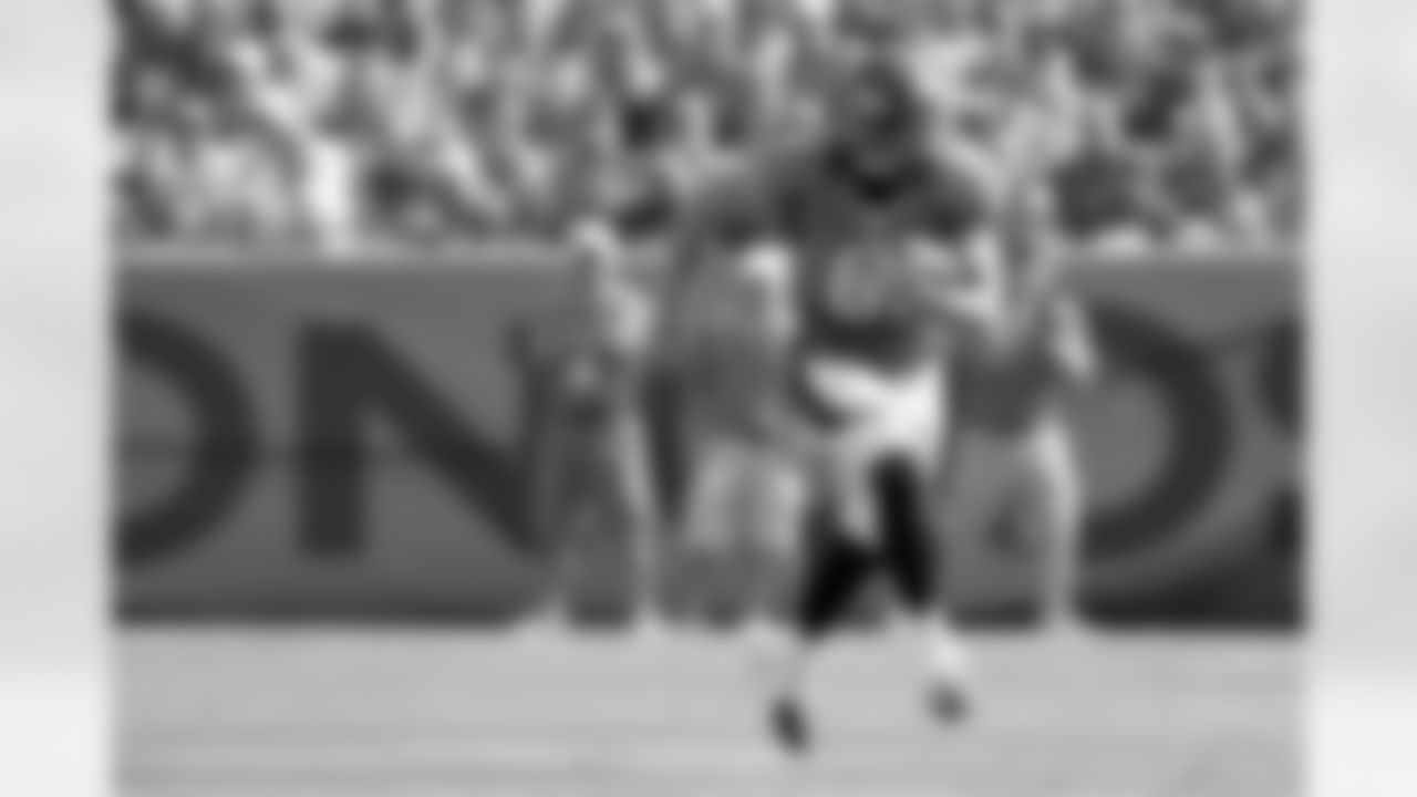 TE Joel Dreessen takes to the sideline after hauling in a pass.
