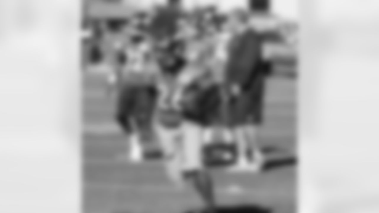 S Rahim Moore carries the ball as he works through a drill.