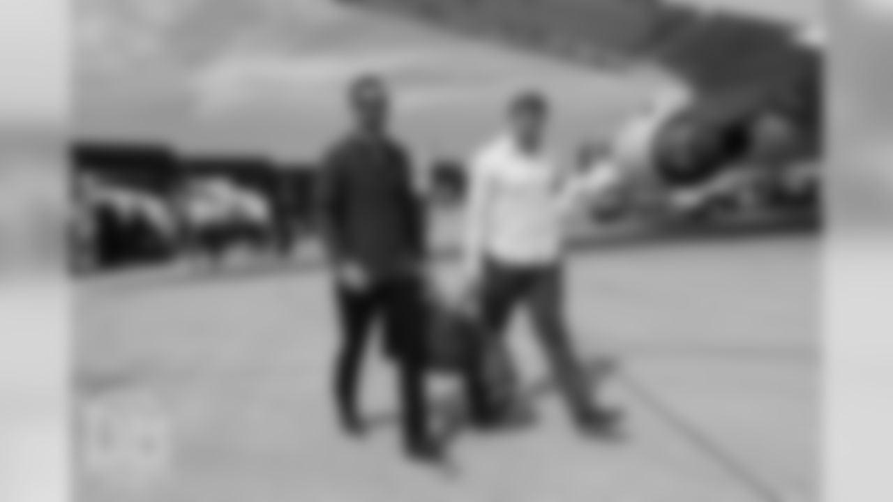 Brandon McManus and Casey Kreiter on the tarmac at Denver International Airport during the team's travel for their preseason game against the Washington Redskins on August 23, 2018.