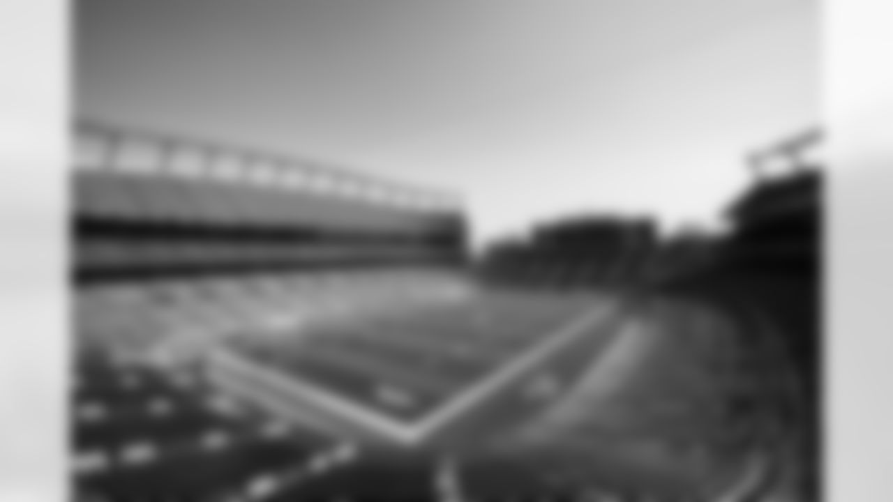 Members of the stadium's turf crew paint the field at Empower Field at Mile High on September 23, 2021 ahead of the team's Week 3 home opener. (Photo by Ben Swanson)