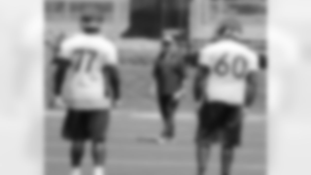 Head Coach John Fox laughs with offensive linemen Quentin Saulsberry and Vinston Painter.