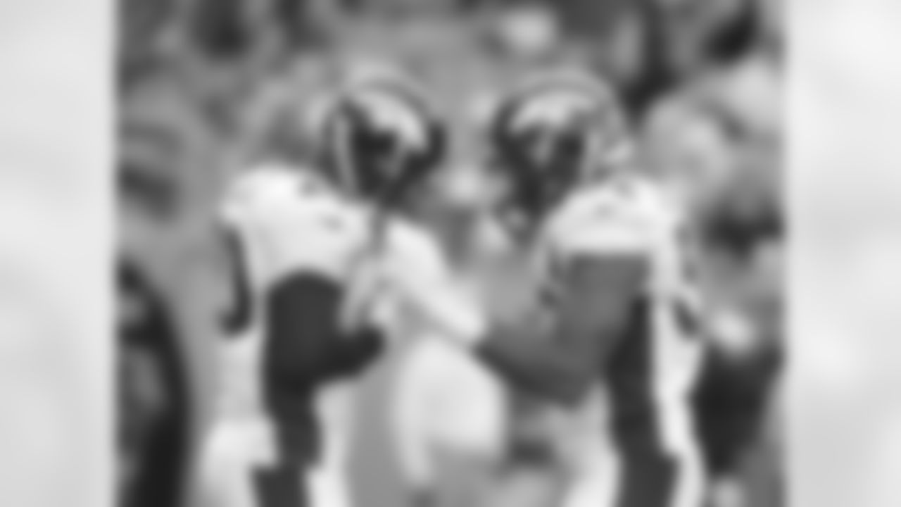 Adams and Woodyard celebrate together.