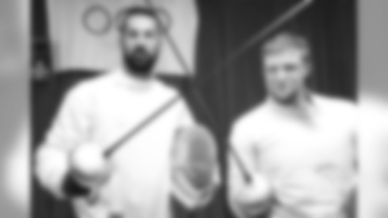 Brandon McManus and Casey Kreiter try their hands at fencing at the Denver Fencing Center on July 17, 2018.