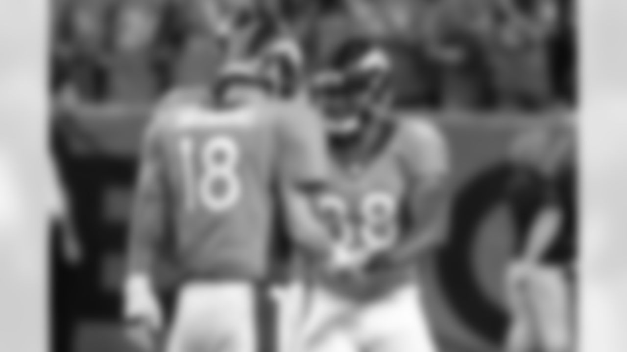 Denver Broncos wide receiver Demaryius Thomas (88) and quarterback Peyton Manning (18) celebrate a 78-yard touchdown during fourth-quarter action against the Baltimore Ravens on September 5, 2013. The score was Manning's seventh of the day, tying an NFL record for most passing touchdowns in a single game.