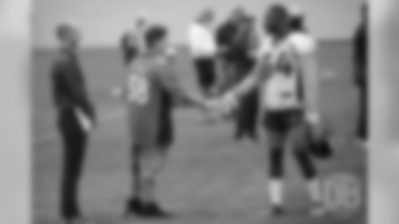 TJ, a 12-year-old fighting cystic fibrosis, wanted to be Von Miller for a day, and the Make-A-Wish Foundation helped make that dream come true on September 29, 2018. Here, Will Parks shakes hands with him at practice.