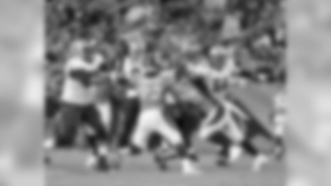 Dumervil and Miller converge on Drew Brees.