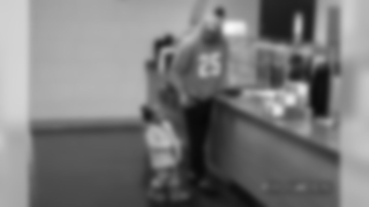 Chris Harris Jr. and one of his daughters during a family breakfast at UCHealth Training Center on November 3, 2018.