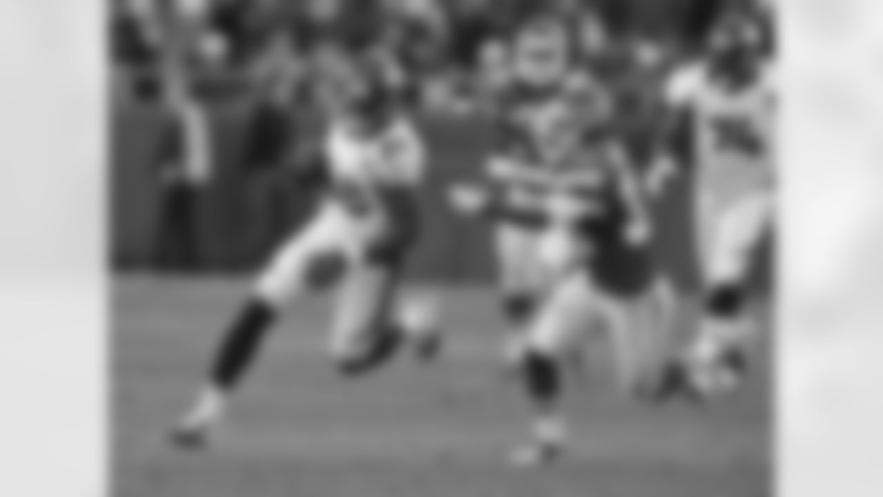 Thomas looks to elude a defender after a second-half reception.