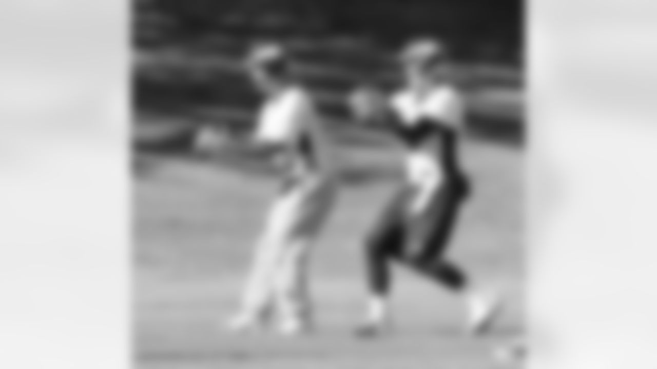 QB Peyton Manning and QB Brock Osweiler take snaps.