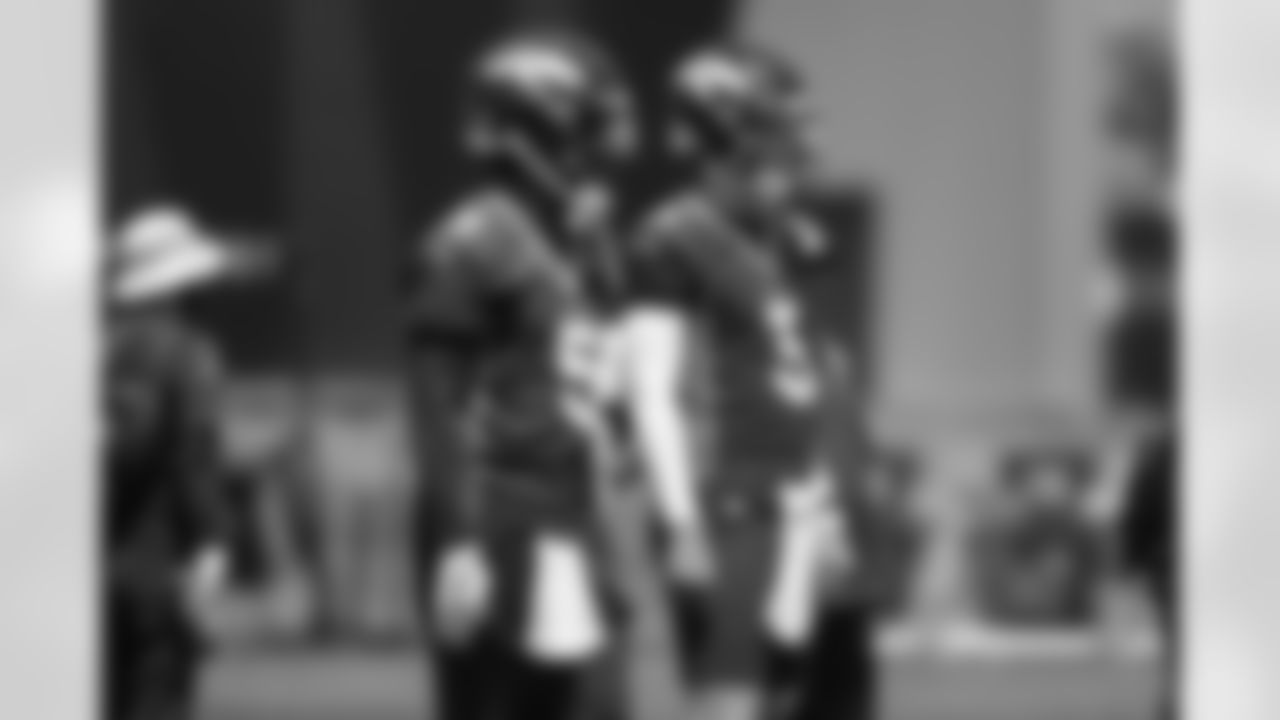 Teddy Bridgewater and Drew Lock during a training camp practice for early reports (rookies, quarterbacks and select veterans) at UCHealth Training Center on July 25, 2021. (Photo by Ben Swanson)