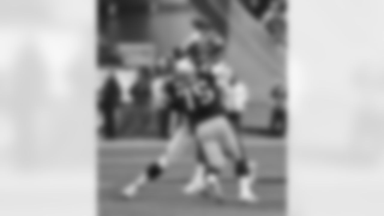 QB Peyton Manning gets rid of the football during the first half against the New England Patriots.