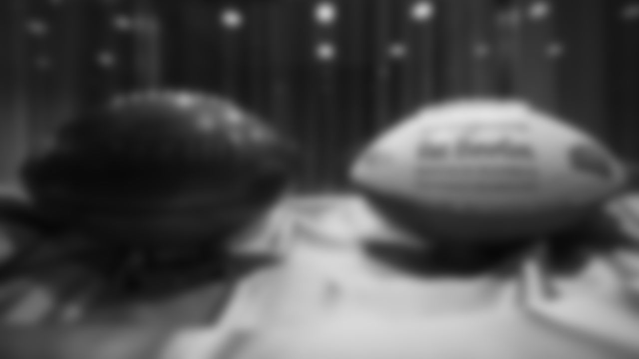 A wooden football commemorating the Broncos' Super Bowl XXXIII win and Mr. Bowlen's game ball for that victory are featured in a display at the open-house tribute to Pat Bowlen at Broncos Stadium at Mile High on June 18, 2019.