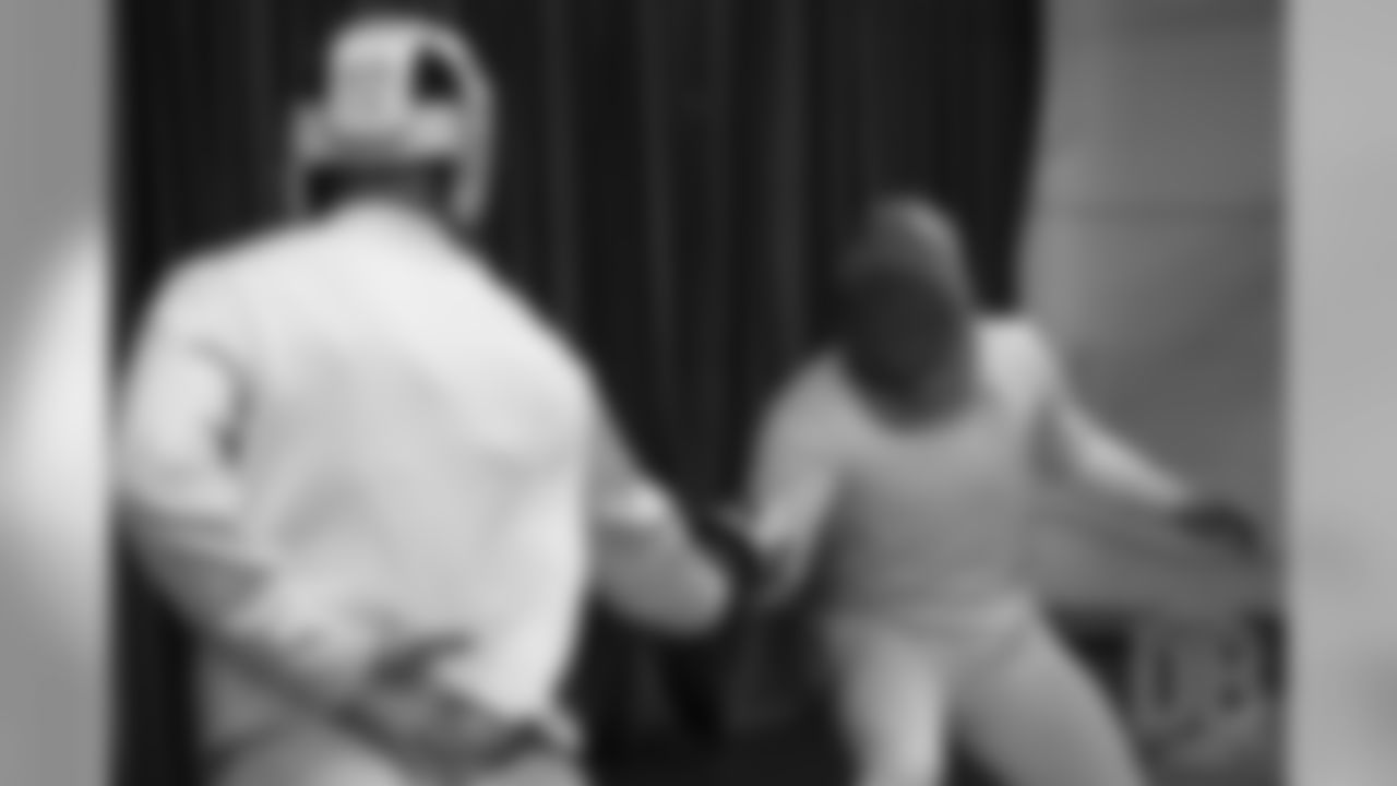 Brandon McManus and Casey Kreiter try their hands at fencing at the Denver Fencing Center on July 17, 2018.