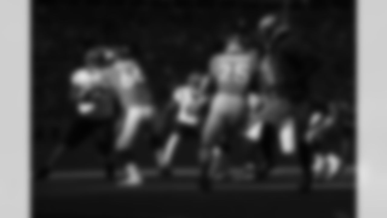 Denver Broncos quarterback Teddy Bridgewater (5) hands the ball off to running back Melvin Gordon III (25) while guard Dalton Risner (66) blocks during the NFL game against the Cincinnati Bengals on Sunday, December 19, 2021 at Empower Field at Mile High in Denver, Colorado.
Photo by Gabriel Christus