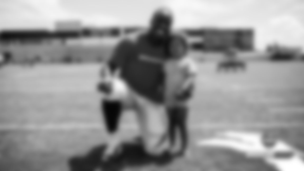 Joe Jones and his daughter Scarlette after practice on Day 8 of training camp on July 26, 2019.