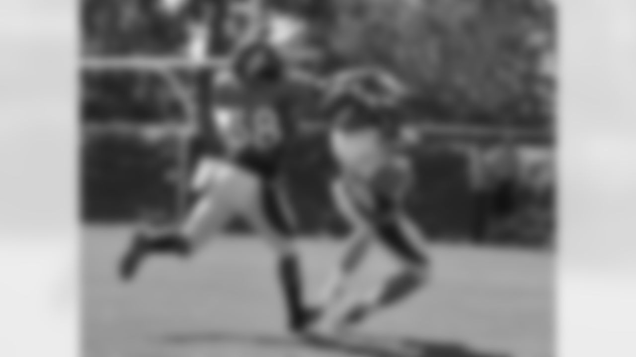 WR Tyler Grisham makes an over-the-shoulder catch.