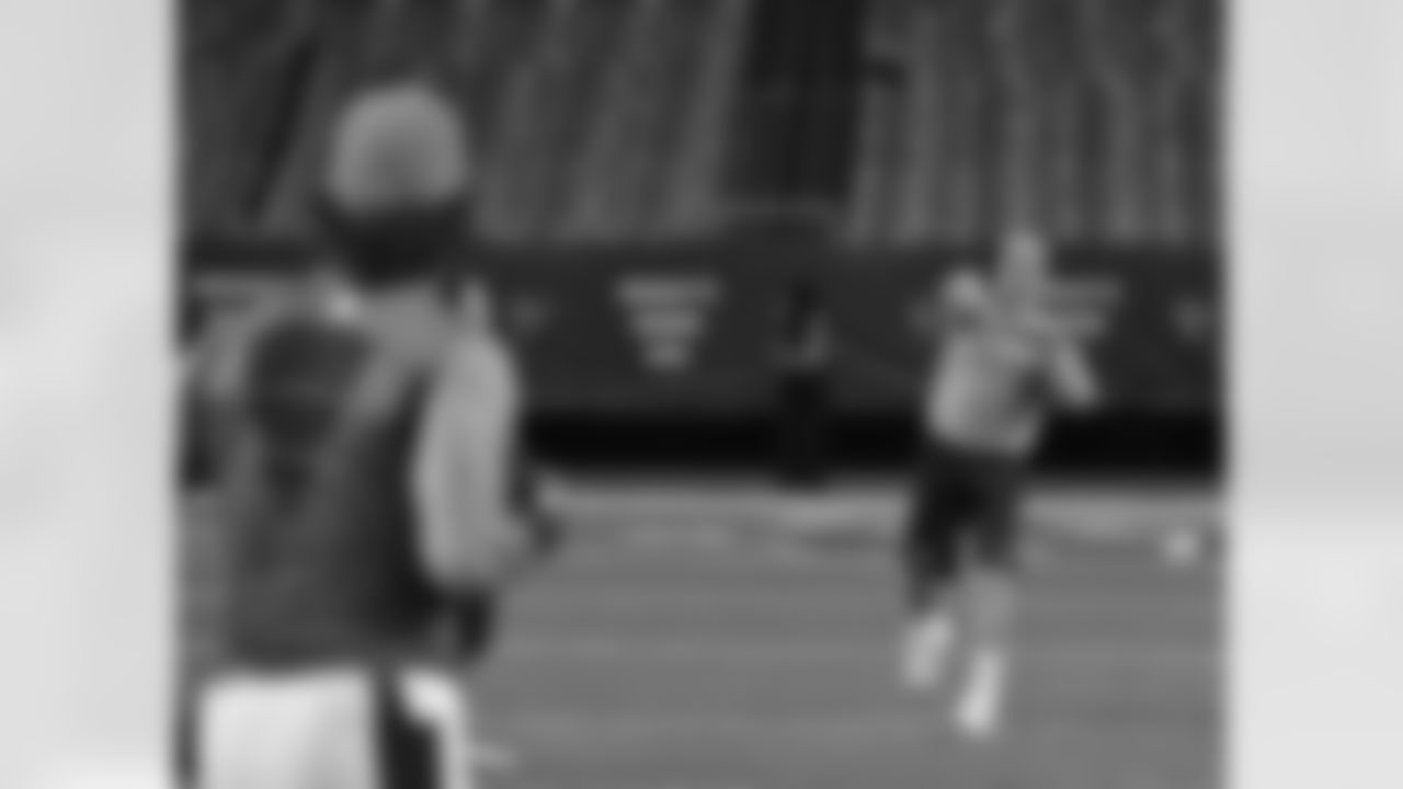 QB Peyton Manning throws a pass during warmups for the Broncos-Falcons game.