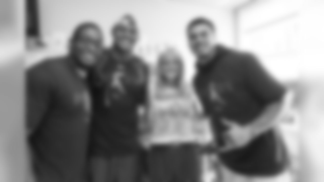 Corey Nelson, Noah Fant and Justin Simmons pose for a photo with a patient during a visit to UCHealth University of Colorado Hospital on September 30, 2019. (Photo by Ben Swanson)