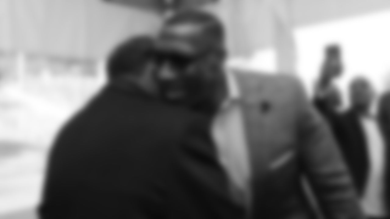 Ring of Fame tight end Shannon Sharpe greets Ring of Fame safety Billy Thompson at the Broncos' Ring of Fame and Fantennial event recognizing the Broncos Top 100 Team on October 11, 2019 at Empower Field at Mile High. (Photo by Gabriel Christus)