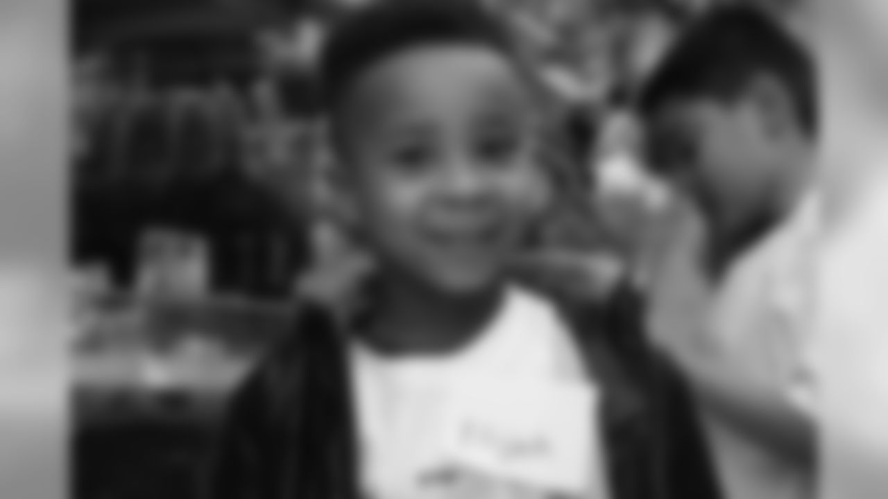 Chris Harris Jr. hosts his 2018 "Shop with a Jock" event, in which he gives 50 children a shopping spree and dinner.