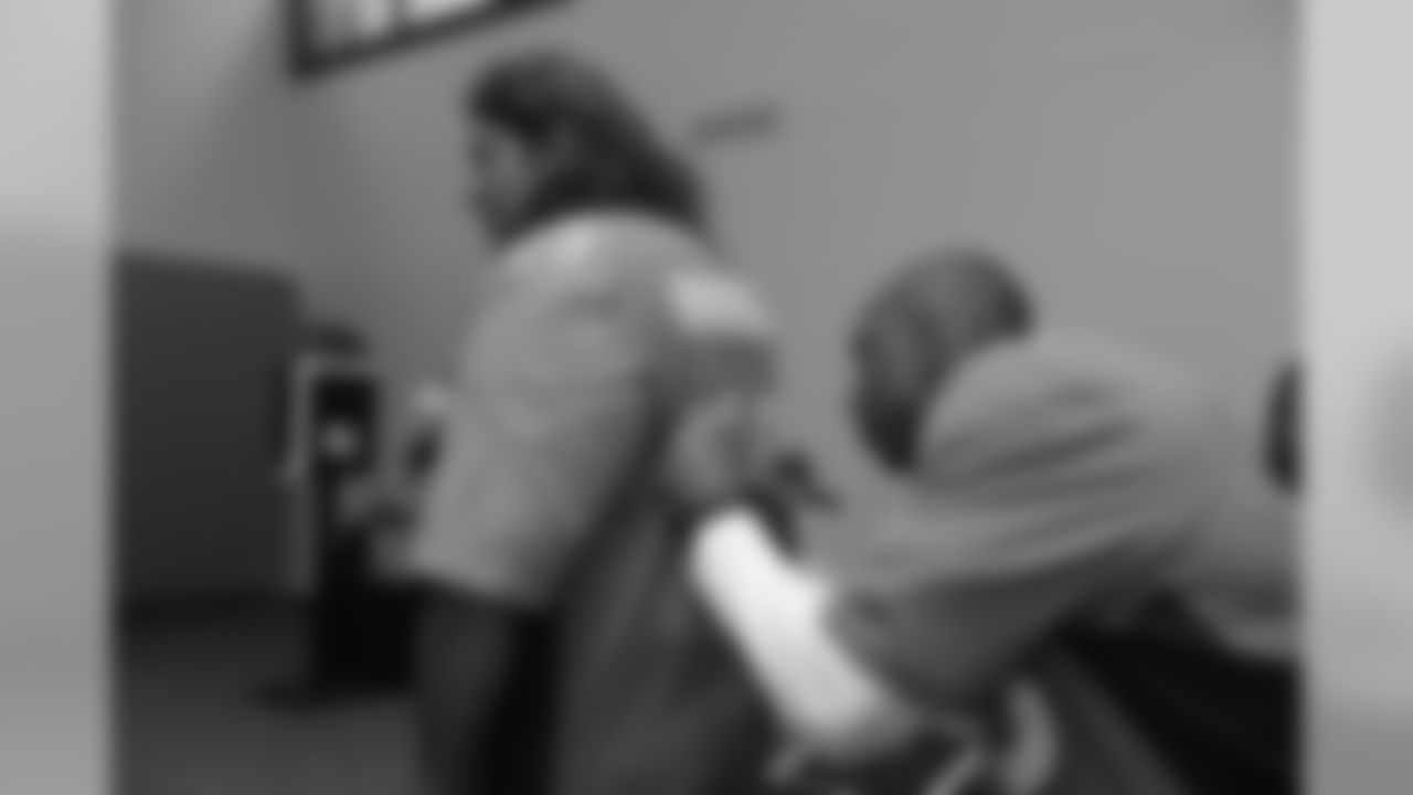 Chris Harris Jr. autographs the jersey of a fan who donated blood at Drive for Life 21, the Broncos' annual blood drive with Vitalant, at Vitalant's headquarters on October 30, 2018.
