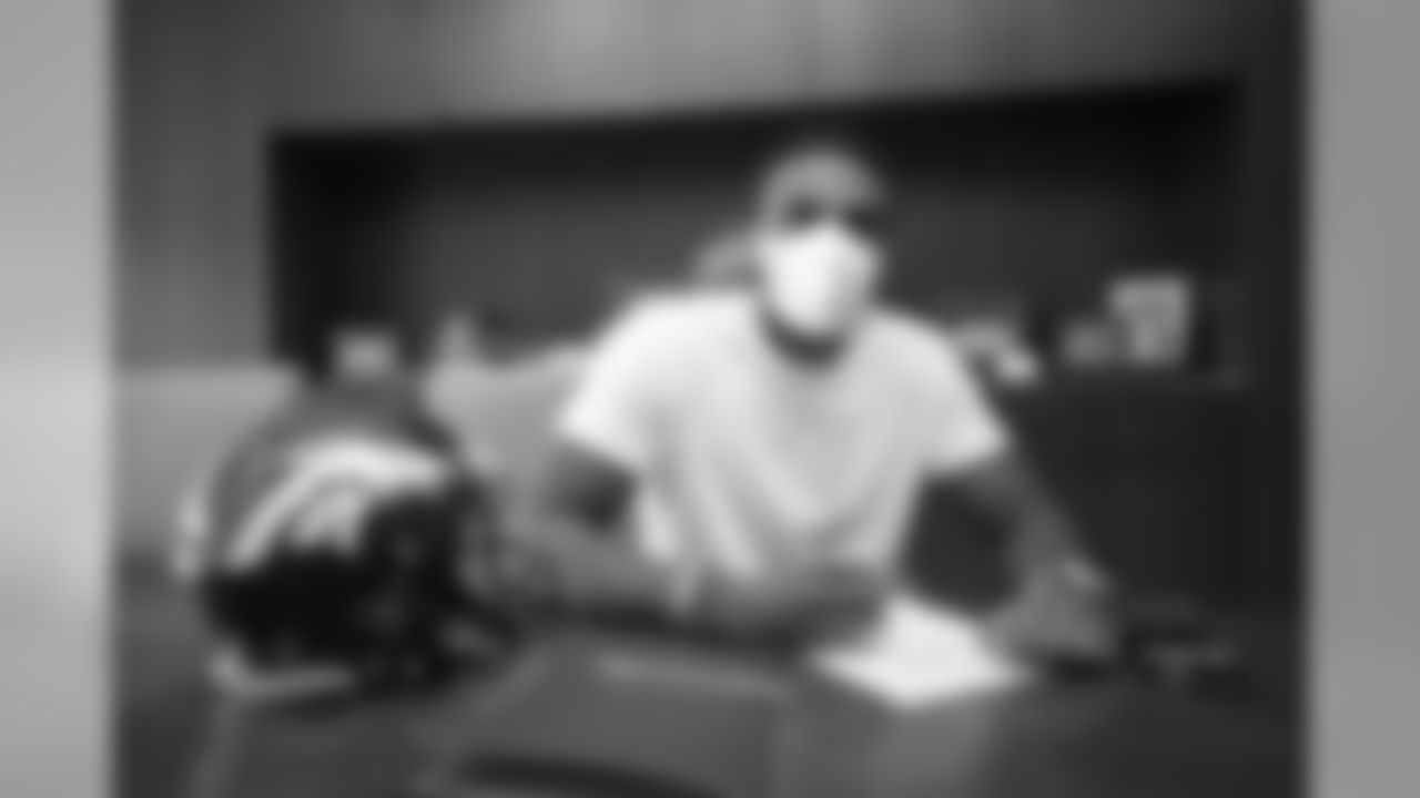 Tyrie Cleveland signs his rookie contract in Pat Bowlen's conference room at UCHealth Training Center on July 27, 2020. (Photo by Ben Swanson)