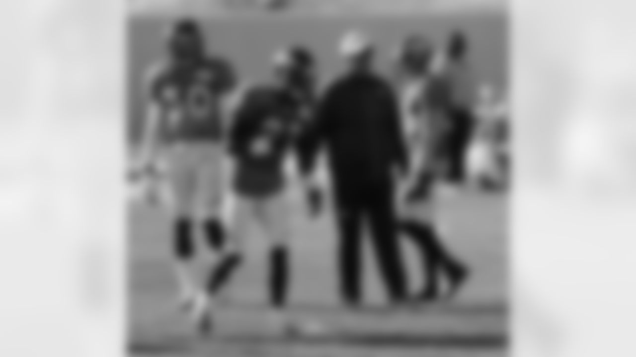 Head Coach John Fox watches the defensive backs go through a tackling drill.