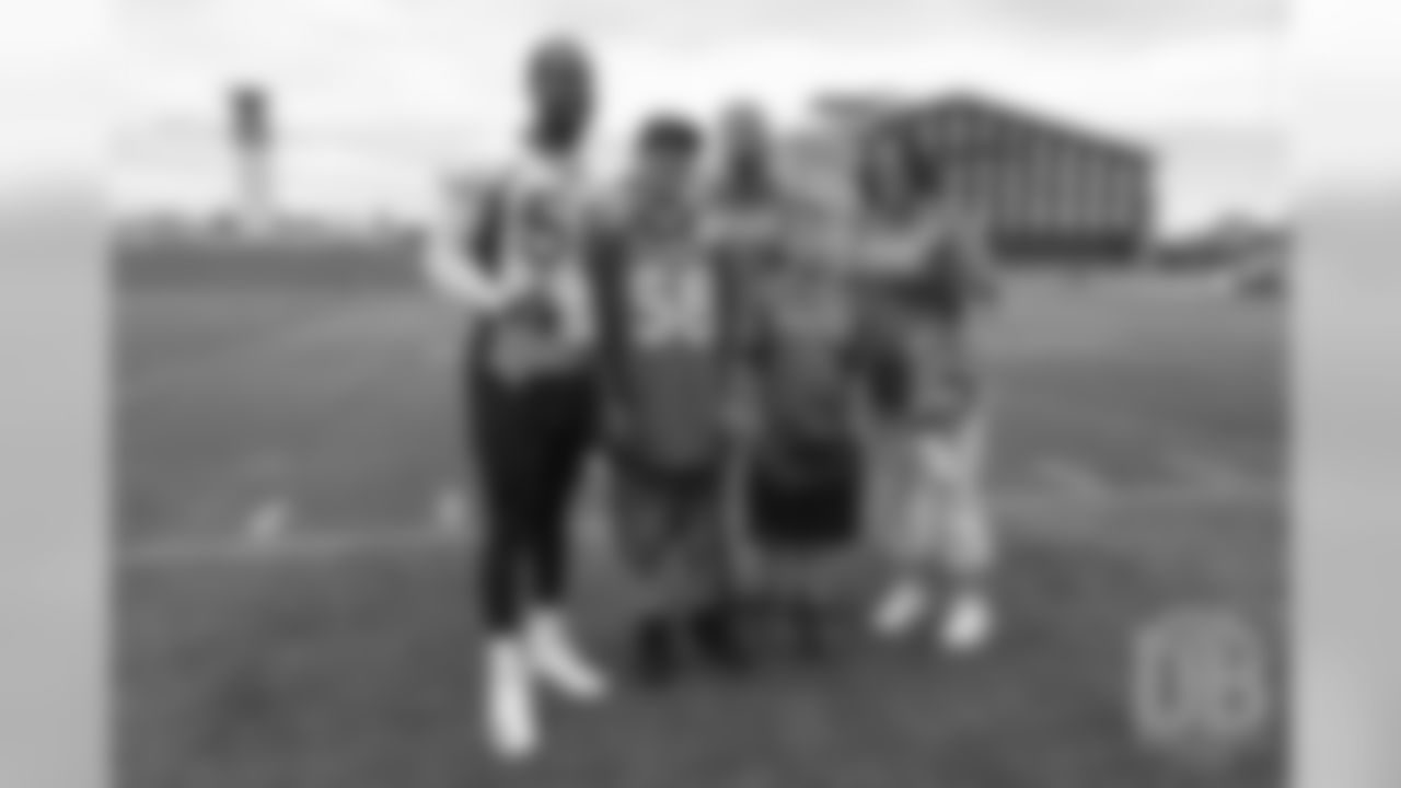 TJ, a 12-year-old fighting cystic fibrosis, wanted to be Von Miller for a day, and the Make-A-Wish Foundation helped make that dream come true on September 29, 2018. Here, TJ and his family take a photo with Miller.