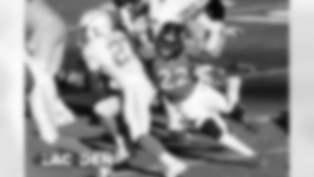 Kareem Jackson makes a tackle on Los Angeles Chargers running back Joshua Kelley (27) during the first half of the Broncos' Week 8 game against the Los Angeles Chargers at Empower Field at Mile High on November 1, 2020. (Photo by Gabriel Christus)