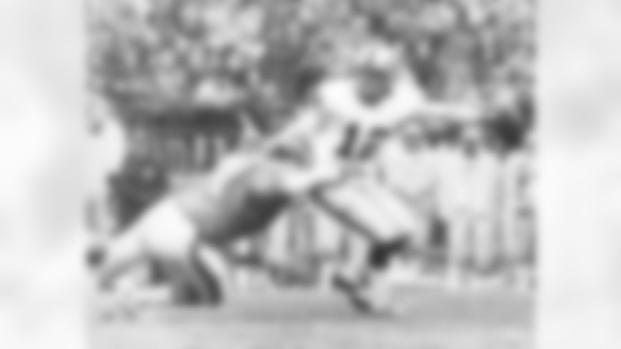 Denver Broncos defensive end Lyle Alzado sacks Oakland Raiders quarterback Ken Stabler during a game in the 1970s.