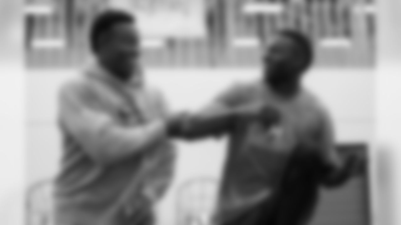 Demaryius Thomas and Emmanuel Sanders share a laugh at a April 19, 2016 offseason program session. (Ben Swanson)