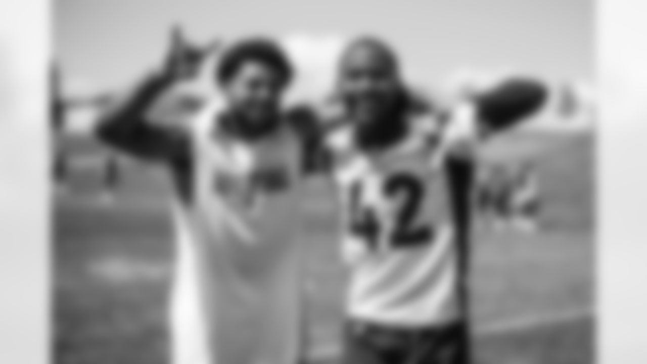 P.J. Locke and Parnell Motley pose for a photo after the seventh day of OTA practices at UCHealth Training Center on June 7, 2021. (Photo by Ben Swanson)