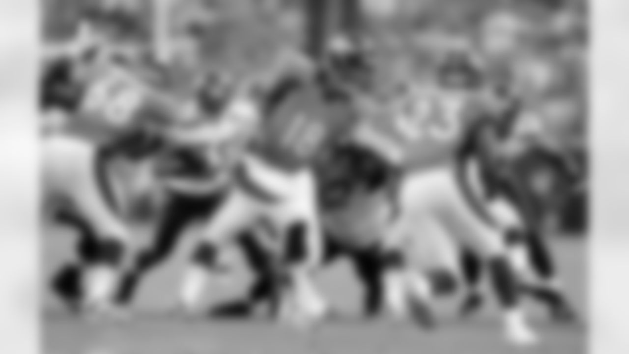 Manning hands off to running back Willis McGahee.