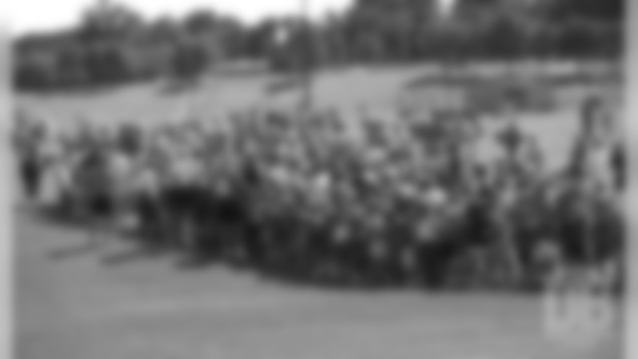 Players sign autographs for fans at 1996 training camp in Greeley.