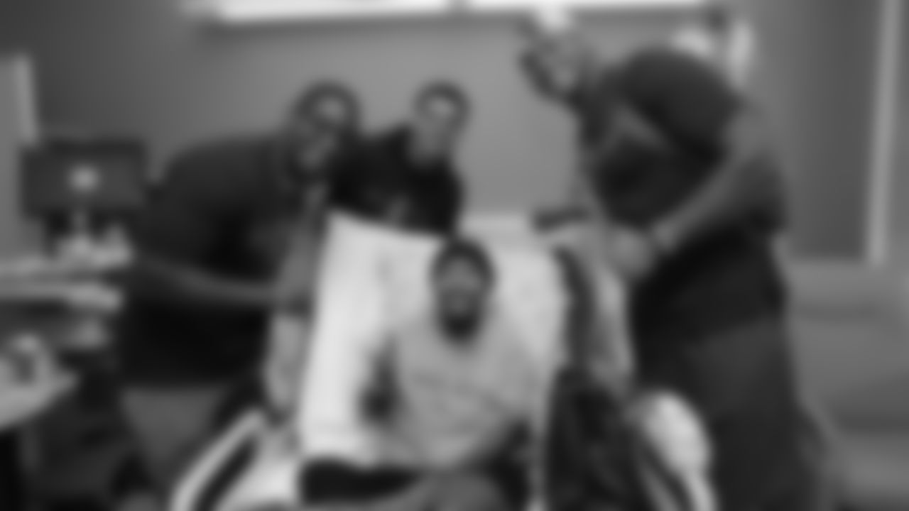 Corey Nelson, Justin Simmons and Noah Fant pose for a photo with a patient during a visit to UCHealth University of Colorado Hospital on September 30, 2019. (Photo by Ben Swanson)