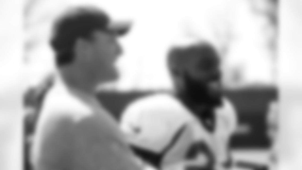 49ers general manager and former Broncos safety John Lynch talks with safety Darian Stewart (26) at a joint practice with the 49ers at Levi's Stadium on August 16, 2017.