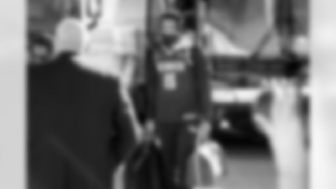 Tim Patrick in a Nikola Jokic Nuggets jersey on the tarmac at Denver International Airport on October 20, 2021 during the team's travel to Cleveland for a Week 7 game against the Browns. (Photo by Joe Abdellah)