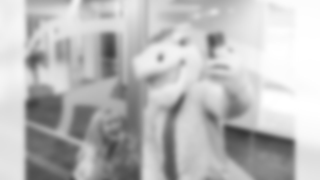 Miles the mascot takes a selfie with actor Angela Kinsey during the taping of the Denver Broncos' 2023 schedule release video at the Denver Broncos' training facility in Englewood, Colorado on April 26, 2023. Photo by Ben Swanson