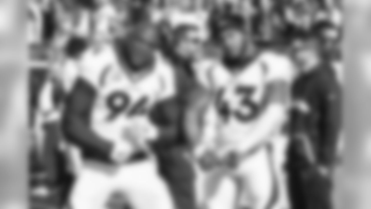 DeMarcus Ware and T.J. Ward pose for a photo prior to kickoff against the Tennessee Titans in the NFL game at Nissan Stadium in Nashville, TN December 11, 2016.