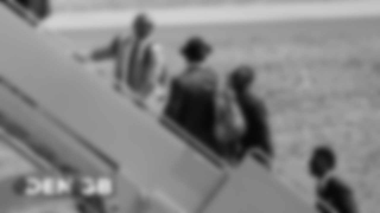 Chris Harris Jr., Von Miller and Will Parks on the tarmac at Denver International Airport during the team's travel to Wisconsin on September 8, 2019 ahead of their Week 3 game against the Green Bay Packers. (Photo by Ben Swanson)