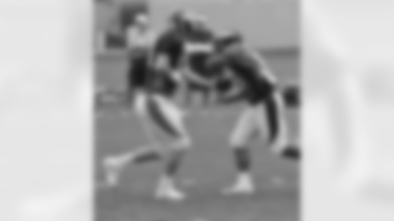 Manning hands off to RB Lance Ball.