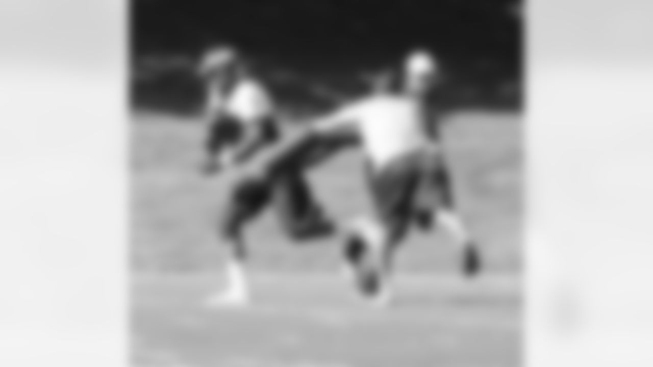 WR Demaryius Thomas plows through contact after making a catch.