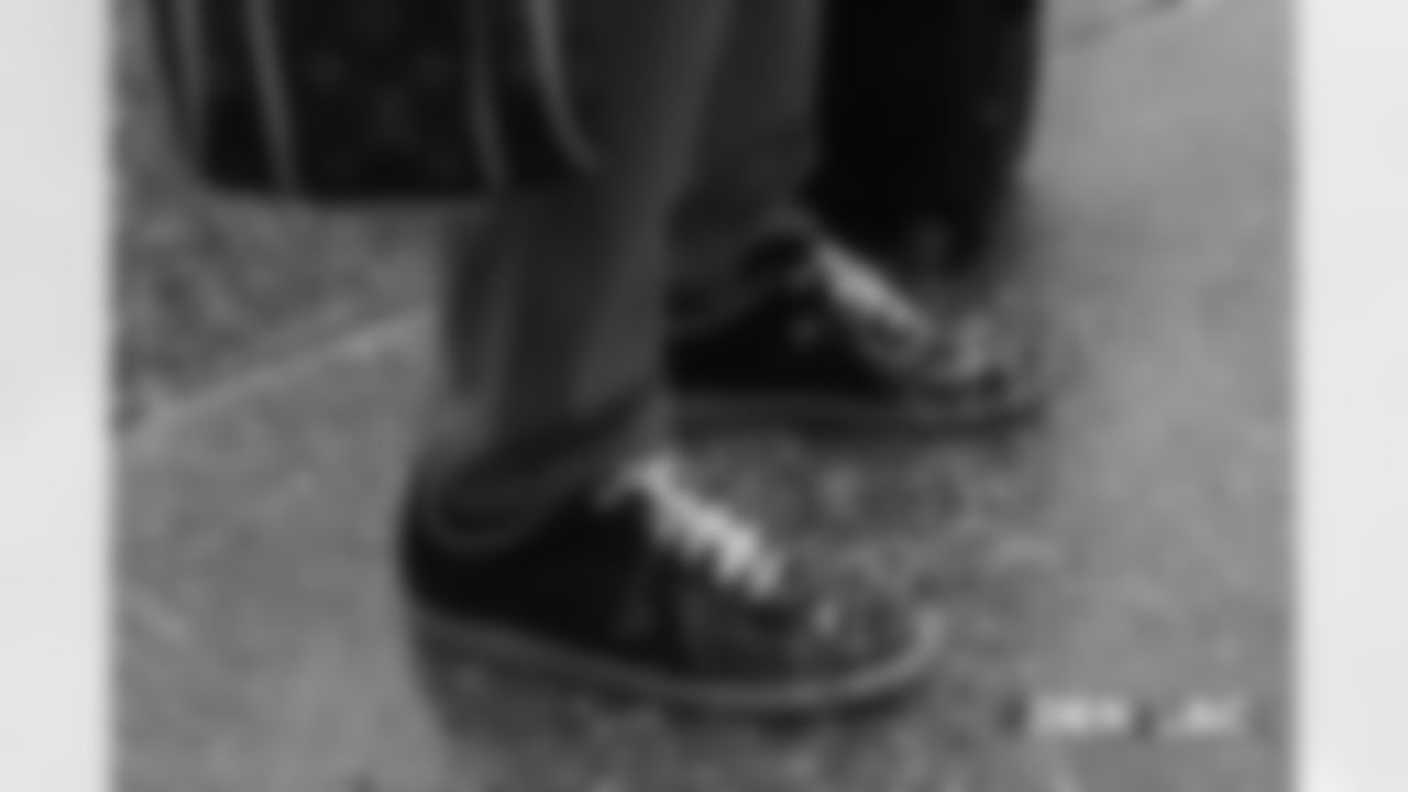 Will Parks' shoes as heÊwalks on the tarmac to the plane before the flight during the team's travel for their Week 11 game against the Los Angeles Chargers on November 17, 2018.